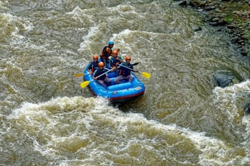 Group rafting on a river surrounded by lush green forest in Peru, capturing the thrill of adventure. Group rafting on a river surrounded by lush green forest in Peru, capturing the thrill of adventure.